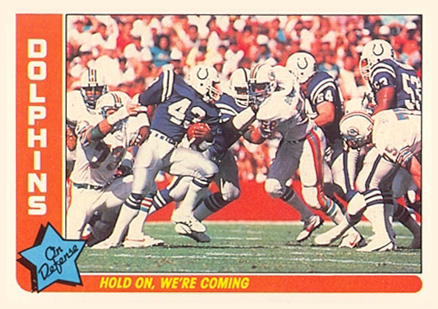 1985 Fleer Team Action Dolphins-Hold on, we're coming #44 Football Card